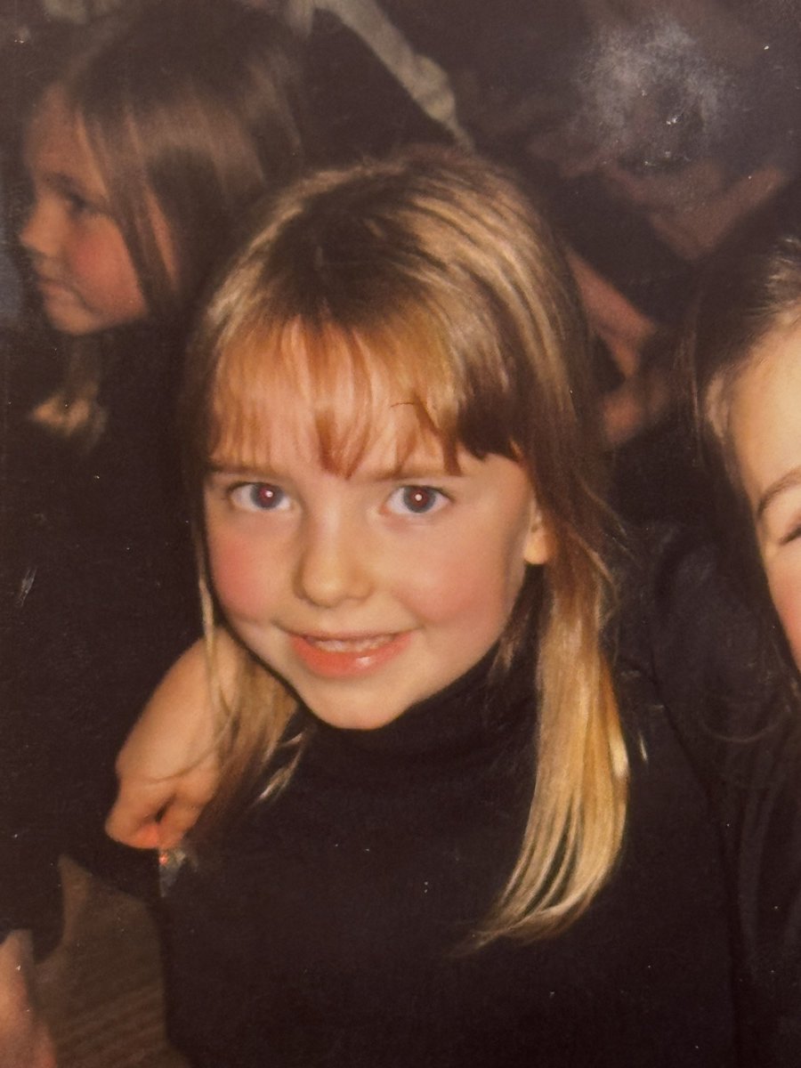 Rebecca as a small child, smiling