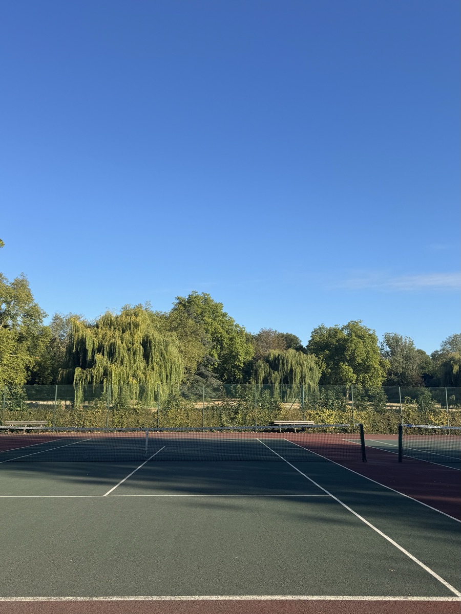Tennis courts near Rebecca’s London flat under a clear blue sky